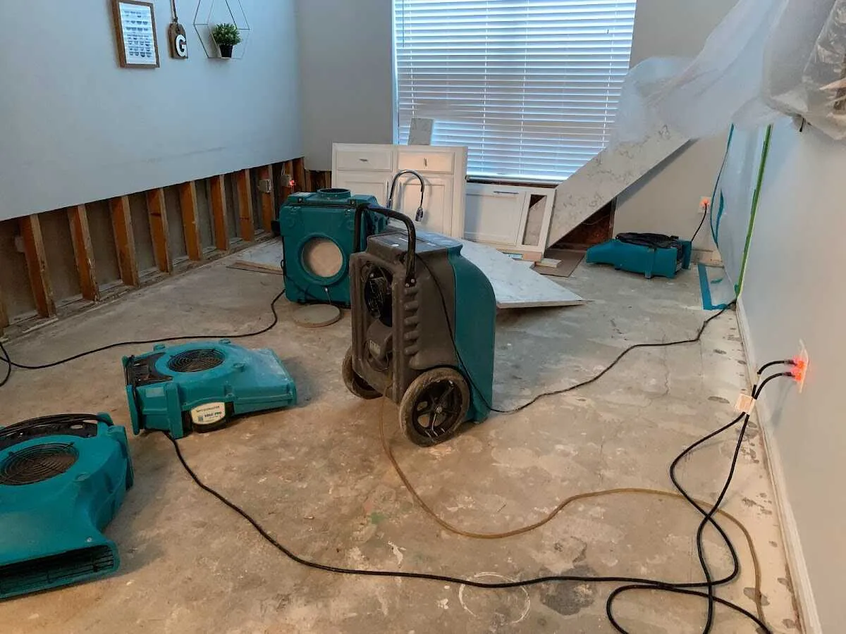 Dehumidifier in flood-cut room for Water Damage Restoration in Groveland